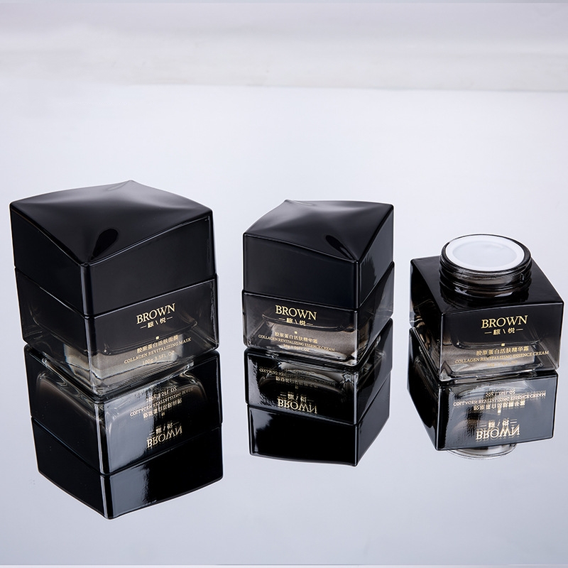 ขวดครีมแก้วทรงสี่เหลี่ยมที่ไม่ซ้ำใครพร้อมการออกแบบฝายกสำหรับบรรจุภัณฑ์เครื่องสำอาง ขวดครีมแก้วทรงสี่เหลี่ยมที่ไม่ซ้ำใครพร้อมการออกแบบฝายกสำหรับบรรจุภัณฑ์เครื่องสำอาง